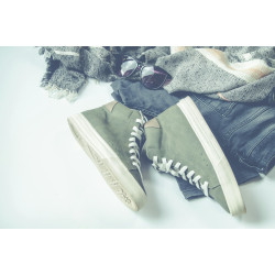 Green High-top Sneakers Beside Bottoms And Sunglasses