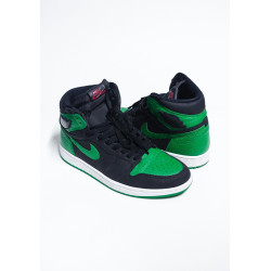 A Pair Black and Green Nike Sneakers