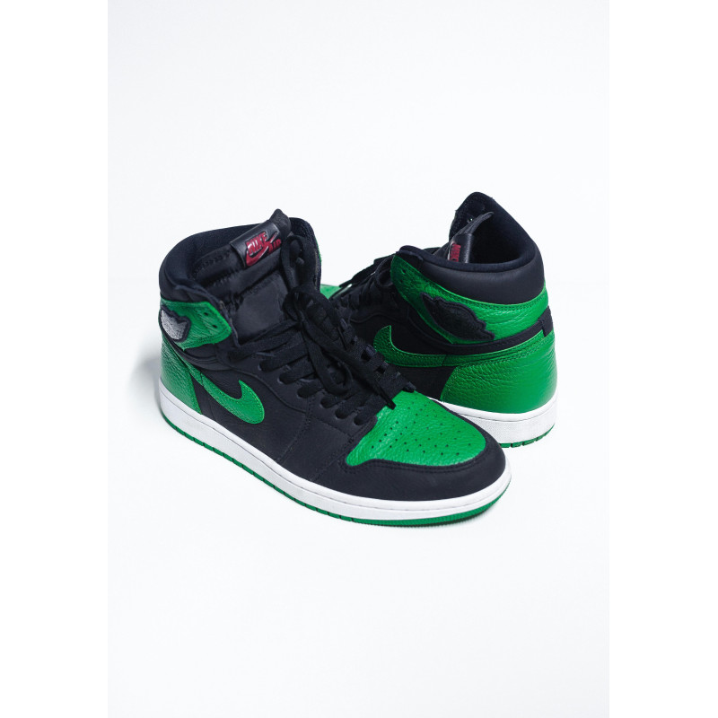 A Pair Black and Green Nike Sneakers