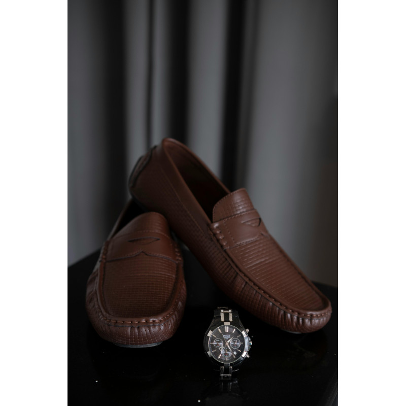 Brown Leather Shoes on a Brown Rattan Surface